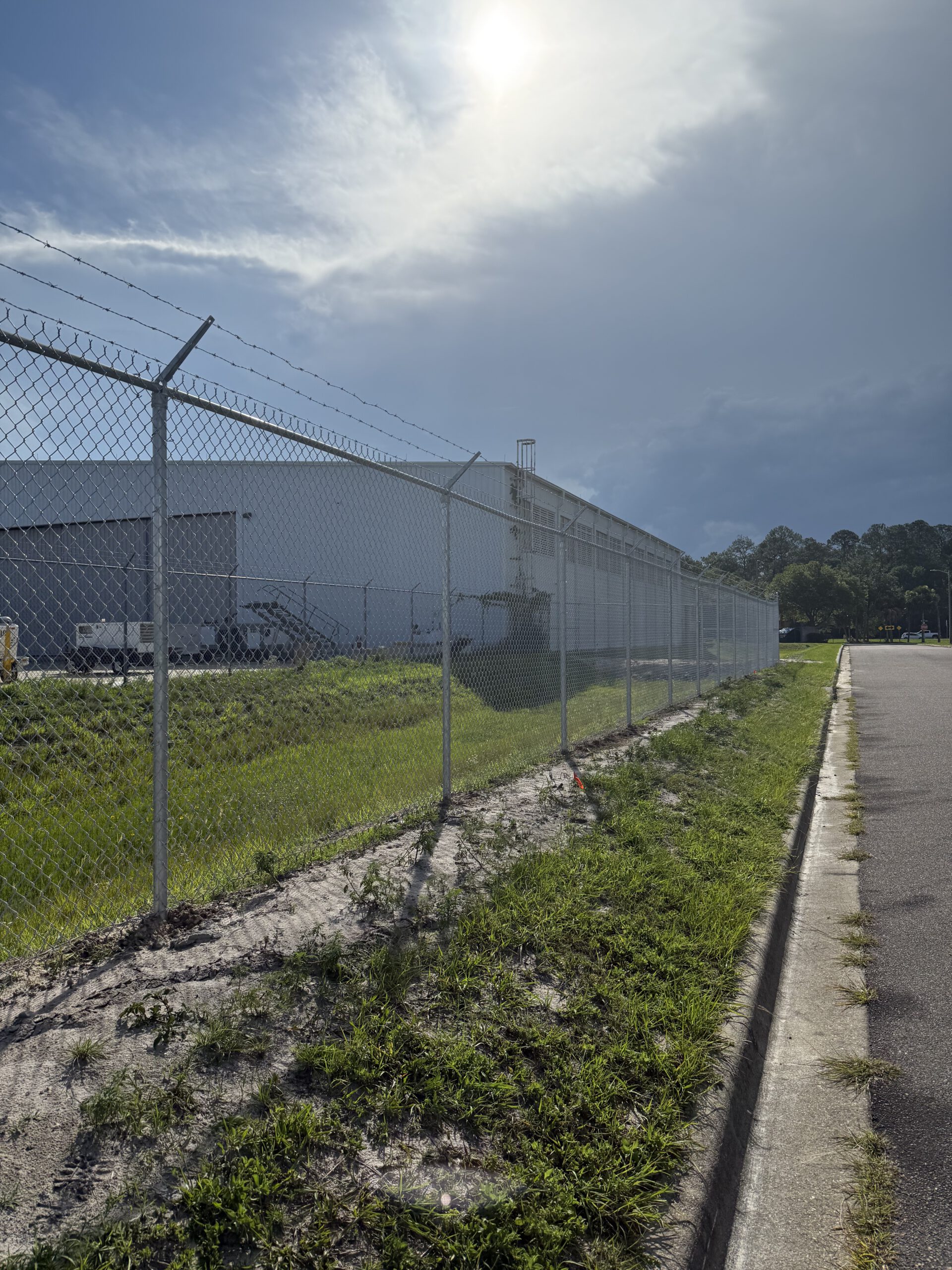Chain link with barbed wire
