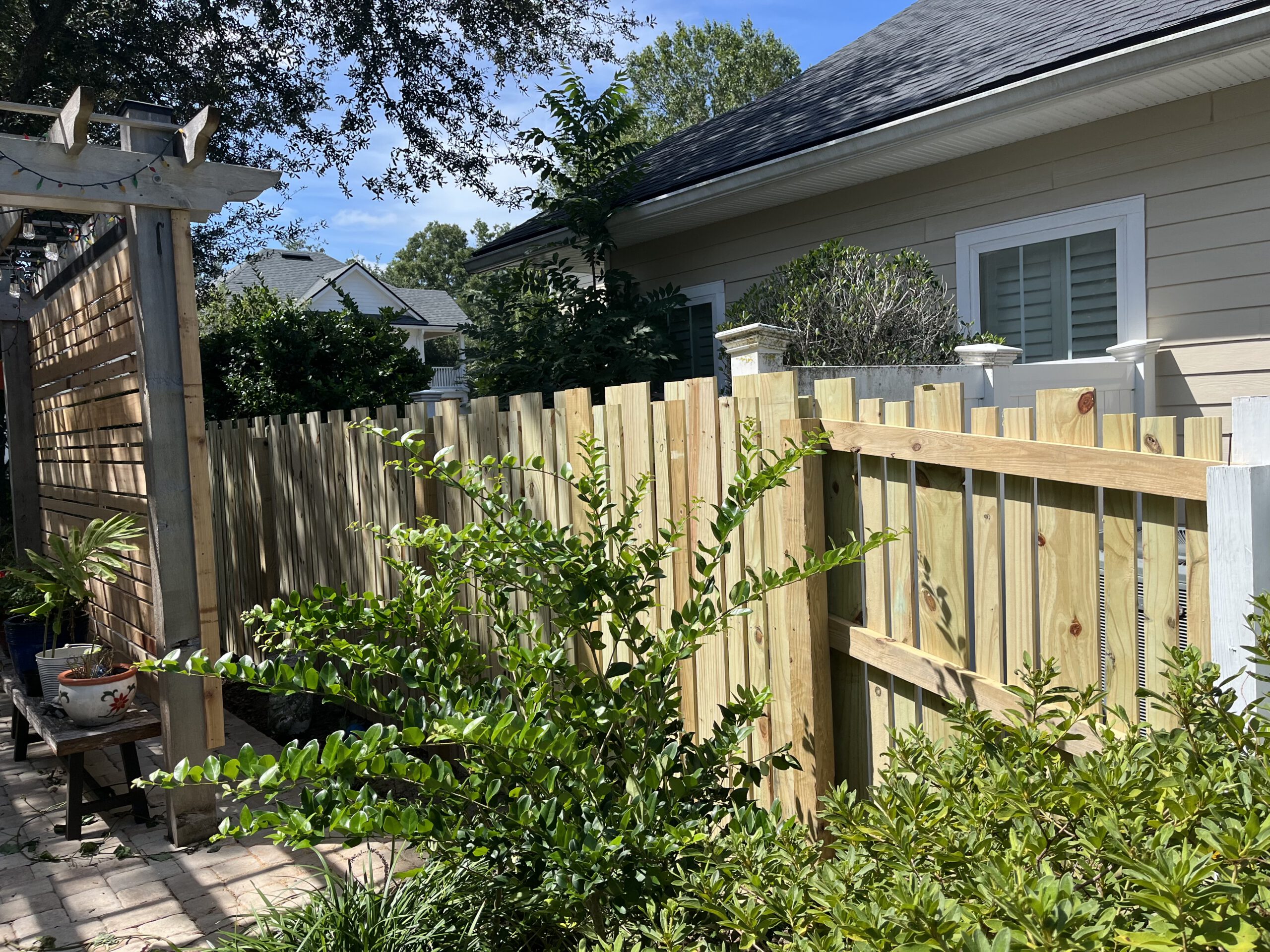 Custom wood fence with arbor gate