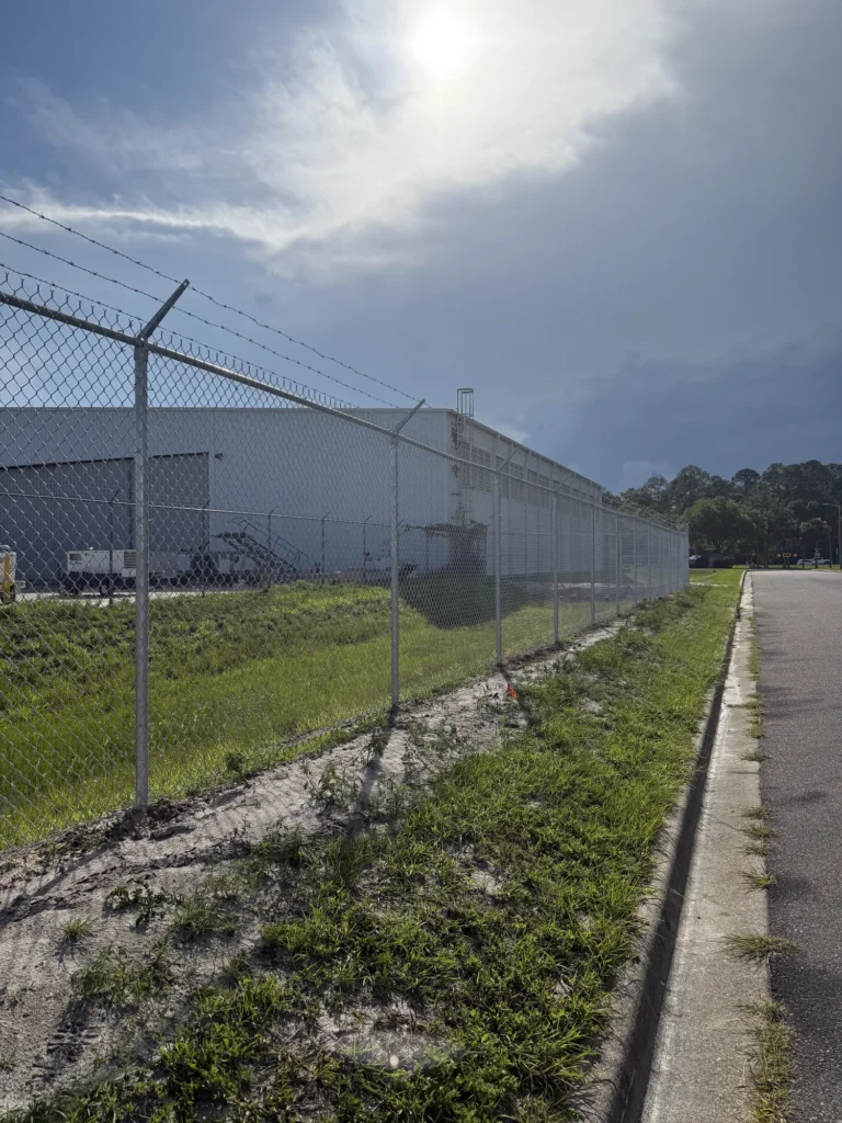 Galvanized chain link security fence protecting a warehouse property
