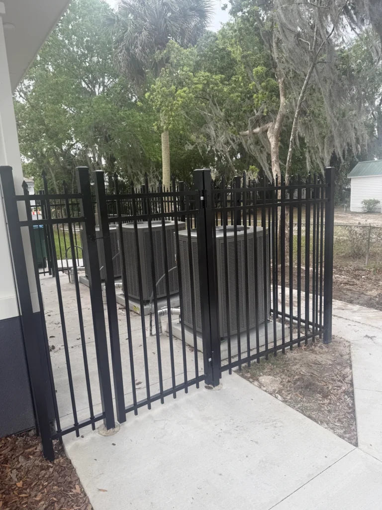 Black aluminum enclosure securing commercial HVAC equipment