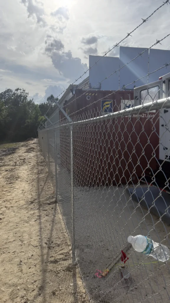 Temporary chain link security fence around an active construction site